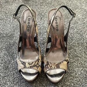 Women’s Bebe snakeskin heels 7